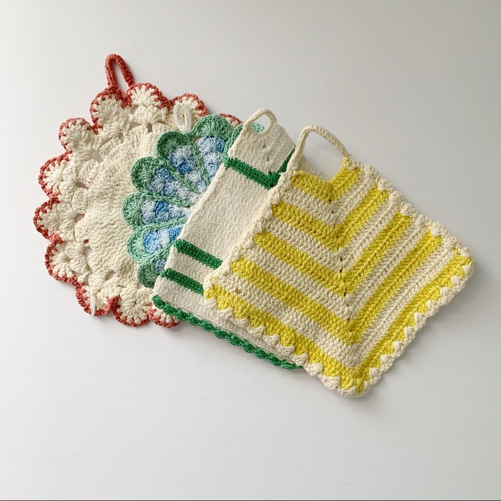 Set of four vintage small crocheted potholders.